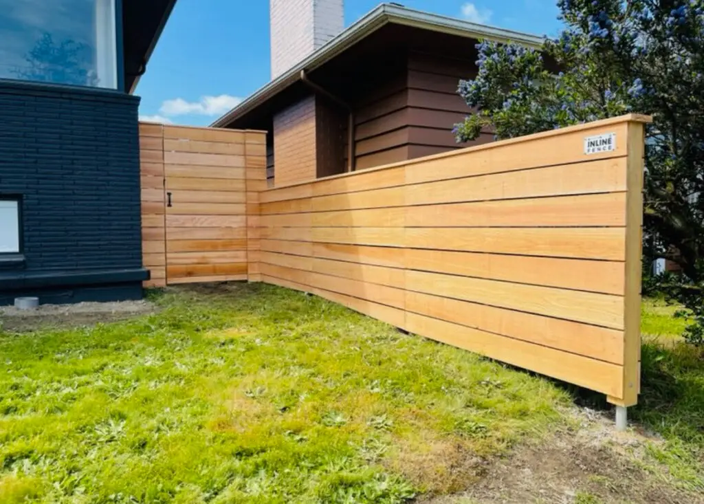 Compact cedar fence with horizontal slats, providing an elegant look for a small backyard in Seattle.