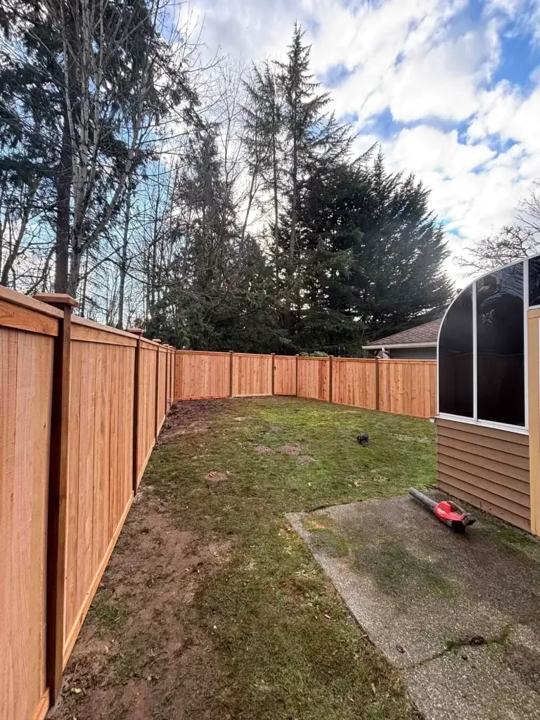 Cedar full-panel fence installed around backyard in Renton with clear cedar boards
