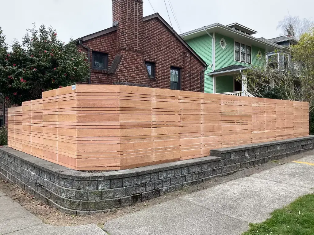 Horizontal wood fence panels creating a clean, modern boundary for a property.