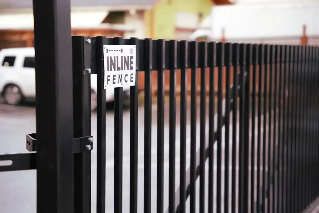 Strong black metal gate installed by Kennewick fence builder for security