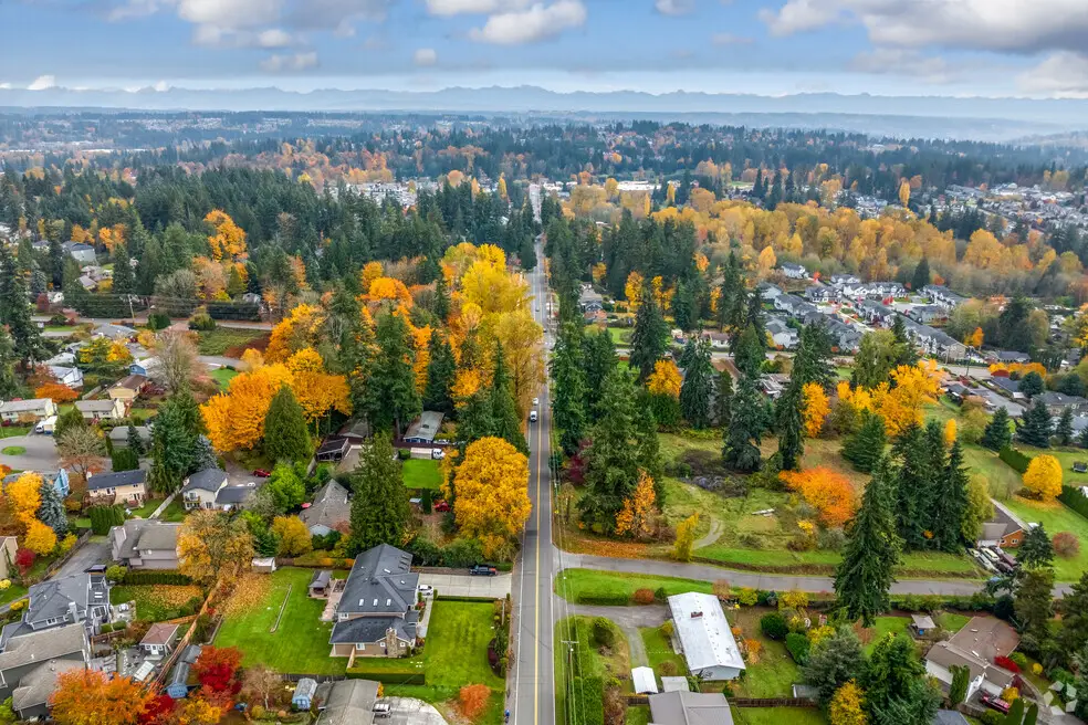Aerial view of a Brier, WA, neighborhood with homes at sunset.