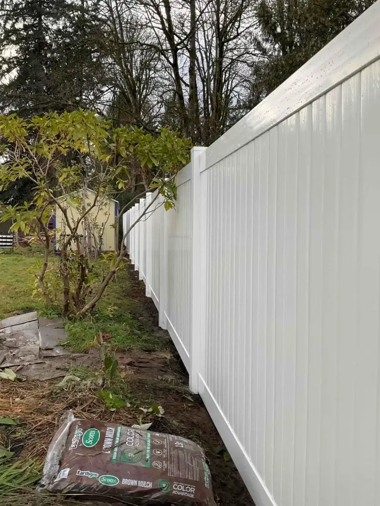 Vinyl privacy fence installed in a Seattle yard, showcasing long-lasting protection and durability for vinyl fence repair Seattle.