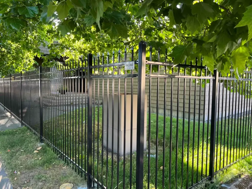 A durable wrought iron fence installed around a property, providing security and style in a Seattle neighborhood.